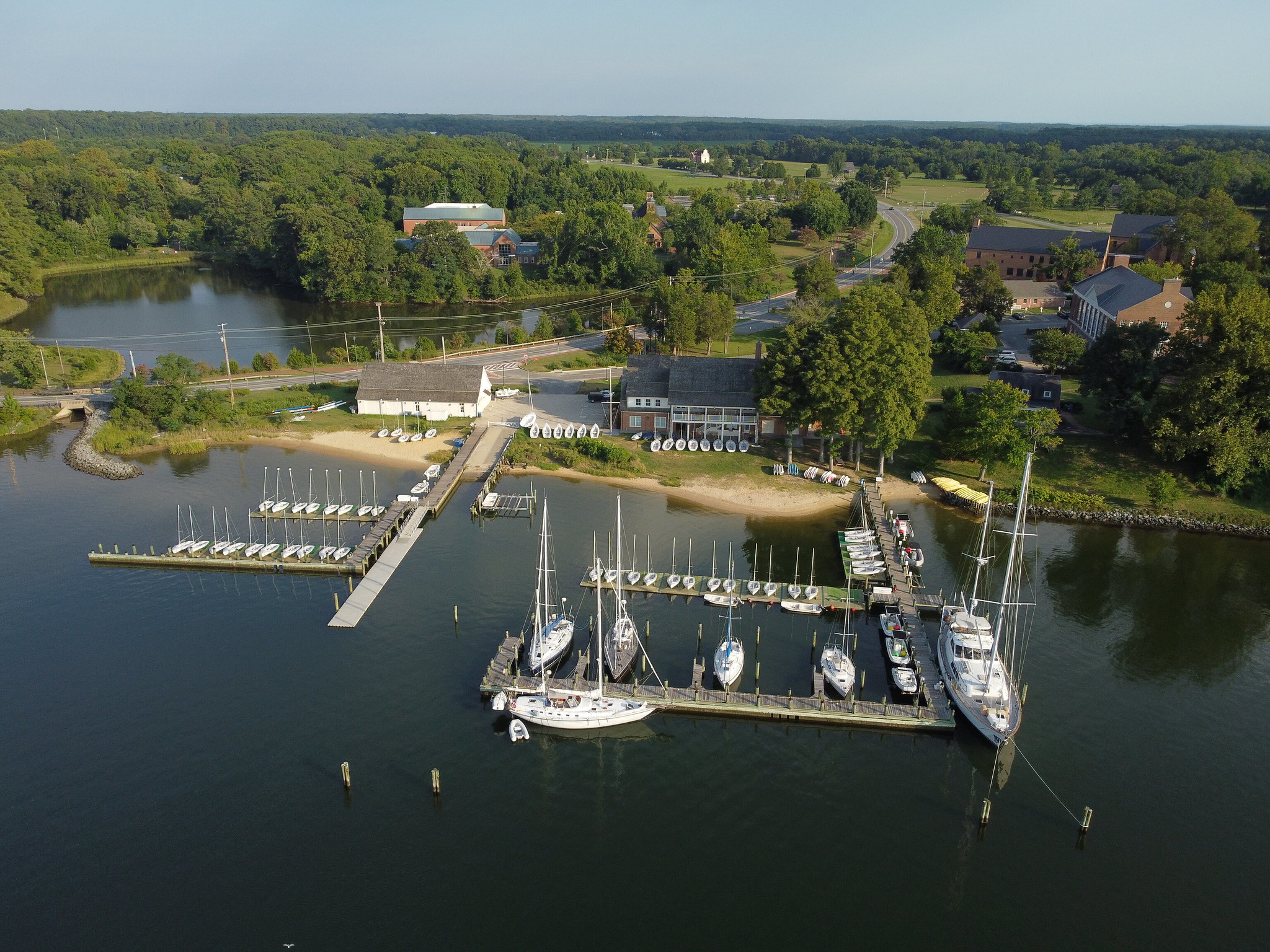 Aerial Shot of St. Mary's College of Maryland on the St. Mary's River Waterfront with boats in the river